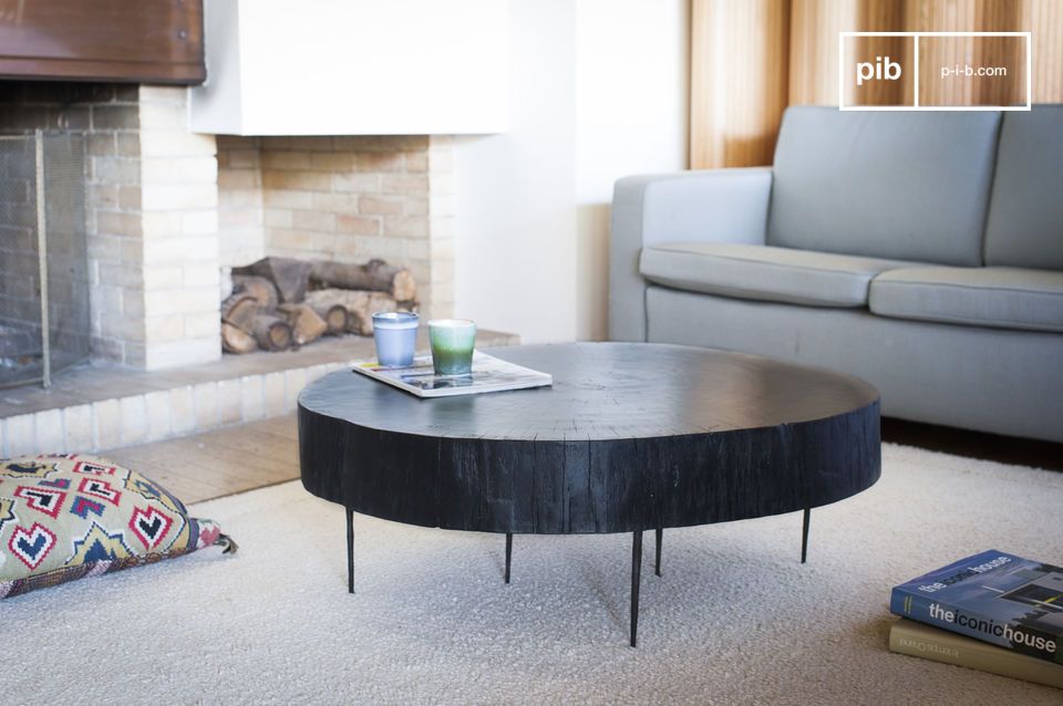 The table is made up of a cut-out of painted and varnished trunk.