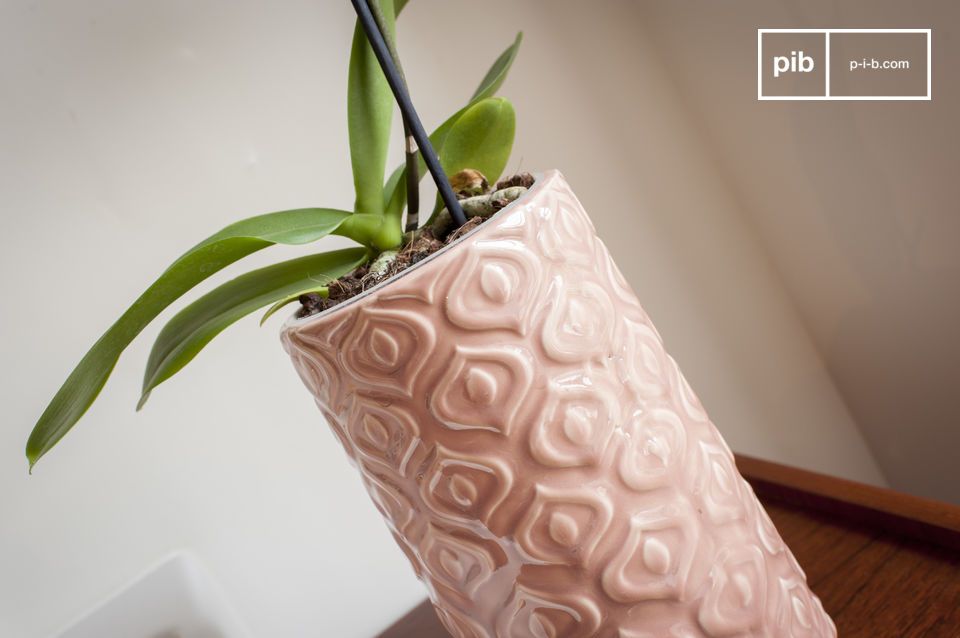 A pink ceramic vase worked in a vintage style full of softness 