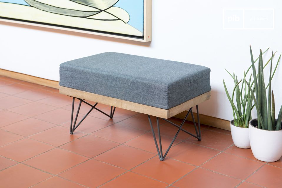 A simple footstool with light wood and dark metal legs.