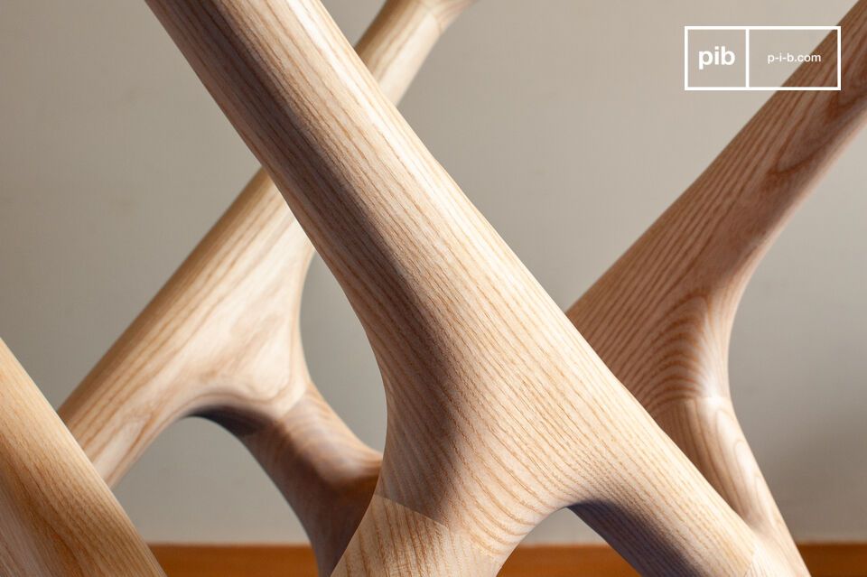 Its tempered glass tabletop rests on a sculpted base
