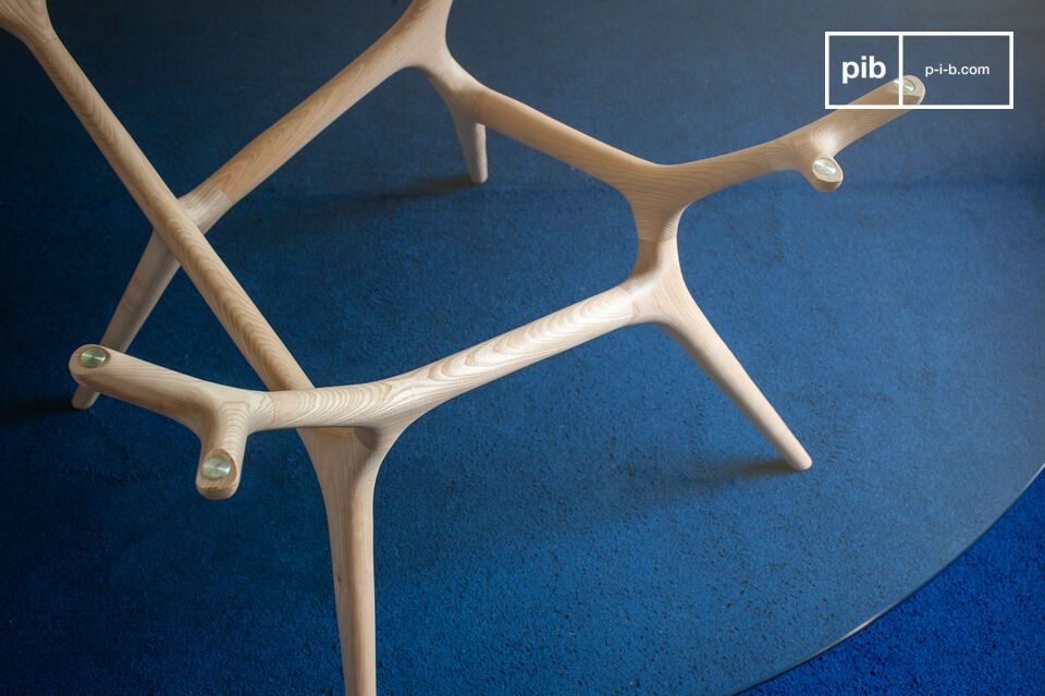 This round table embodies a refined aesthetic where wood and glass blend effortlessly