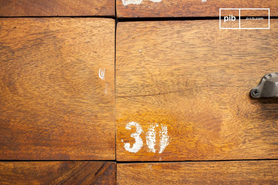 Each drawer is numbered, factory furniture style.