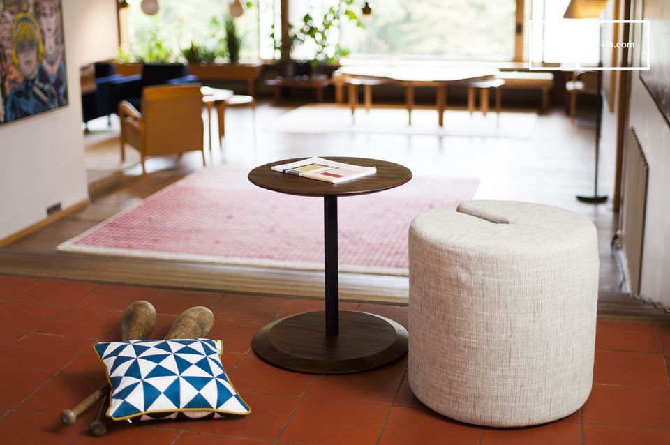 A clever little piece of furniture combining table and footstool.