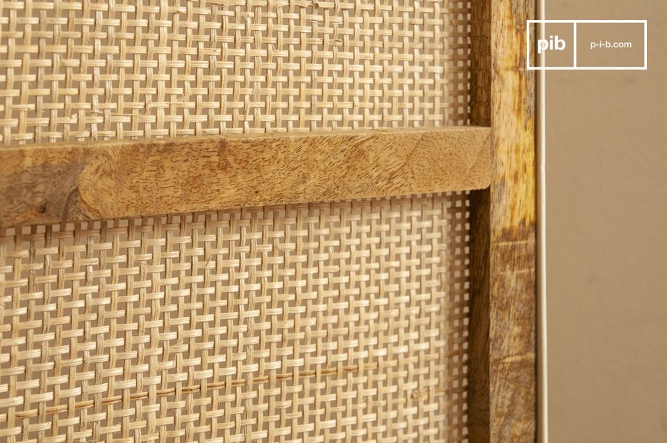 Its natural rattan weave compliments the square lines of its cream-coloured steel structure