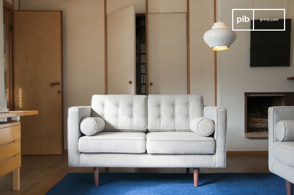 Two-seater sofa in light grey Scandinavian style.