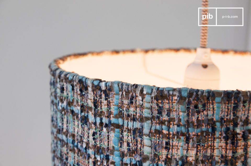 The lampshade is made of a blue knit fabric.