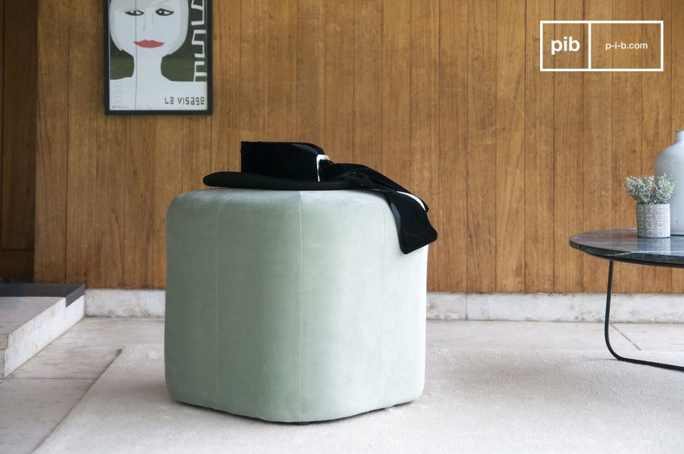 Small geometric velvet pouf with round corners.