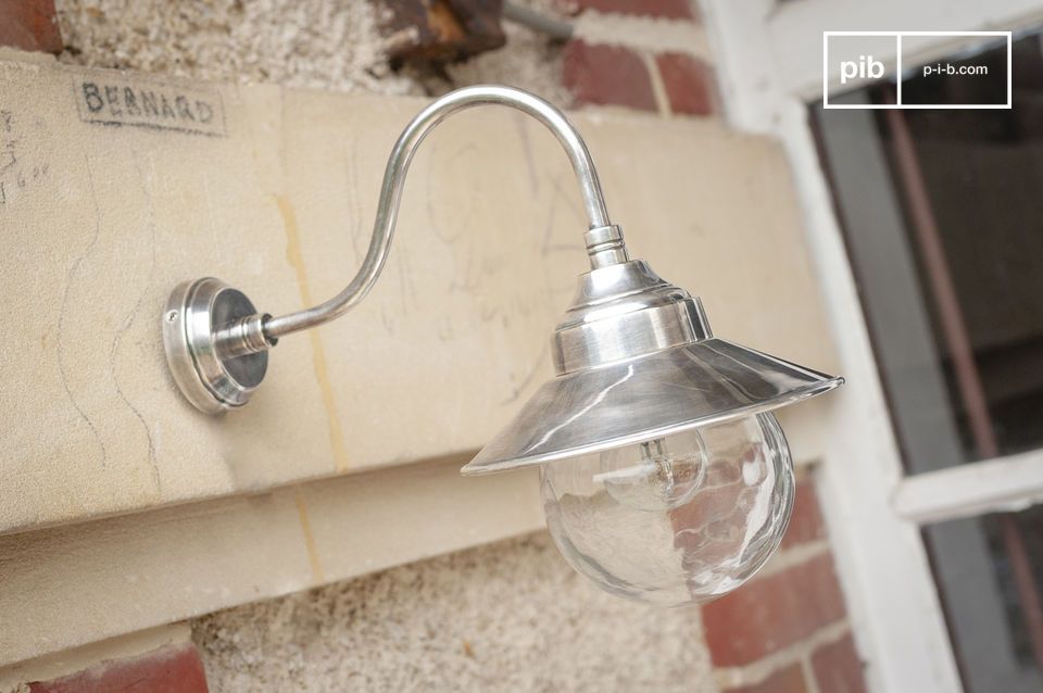 The small silvery Swan neck wall light is an ideal light to highlight your exterior