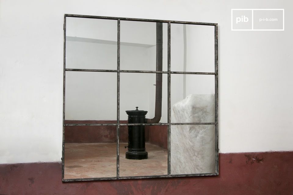 the mirror frame divides the mirror into nine separate squares.