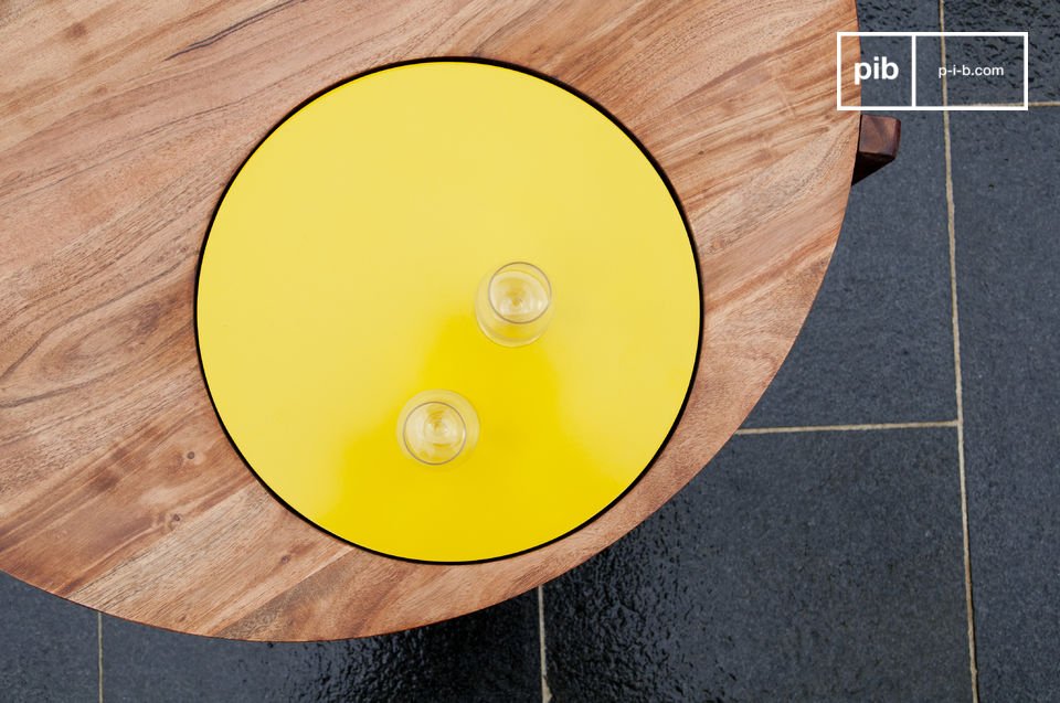 This highly-original living room table has a yellow disk integrated into the wooden top