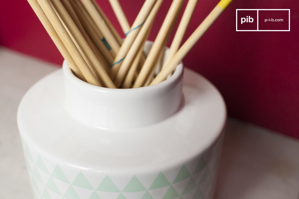 White vase with trendy mint green triangles.