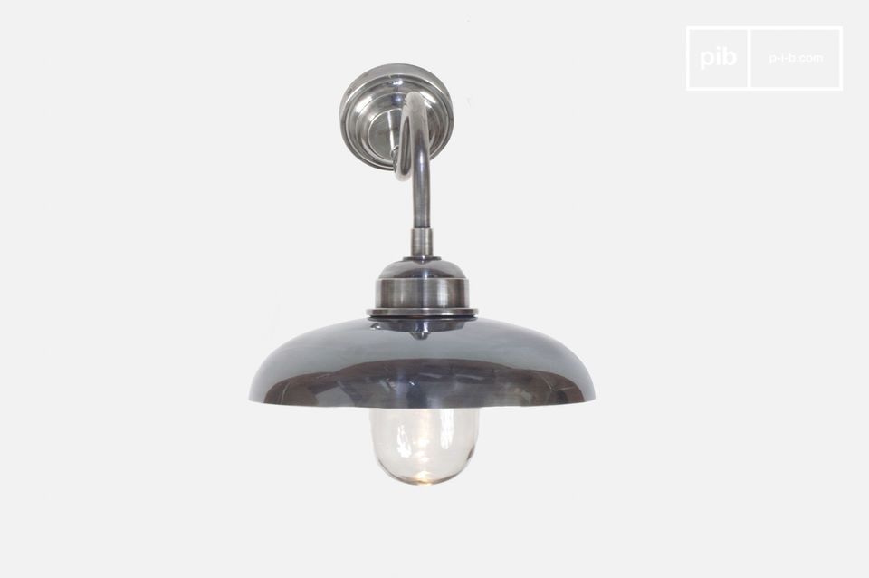Luminaire with a brass body coated with a silver plating.