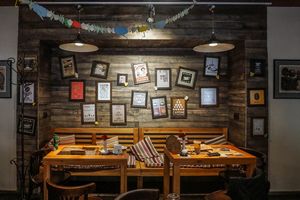 natural wooden table with beautiful frames setting