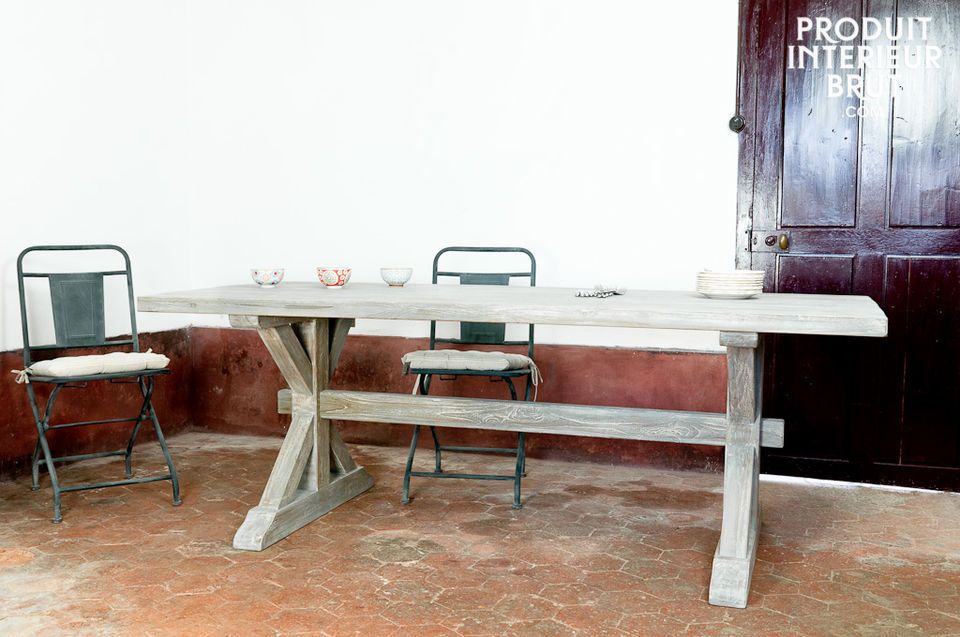 This design with distressed hard teak and its traditional wooden base confers to this table a unique