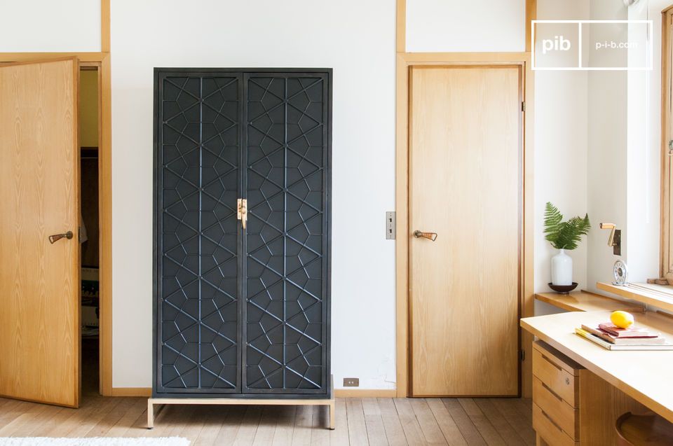 Elegant black metal cabinet with gold accents.