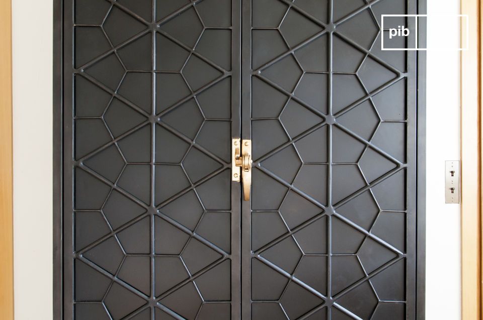 The cabinet doors have beautiful geometric shapes.