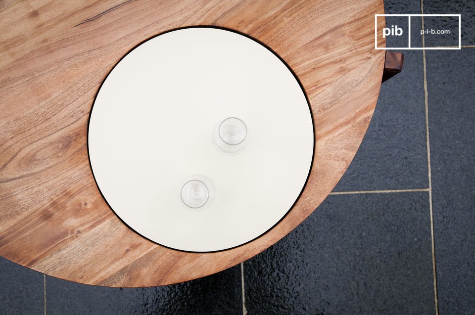 This original coffee table has a beautiful white plate integrated into the round tabletop made of