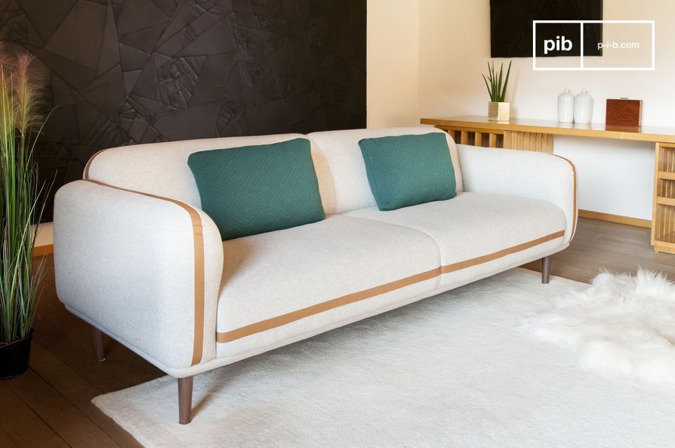 The base of the sofa is made of solid dark-coloured wood, which echoes the leather.