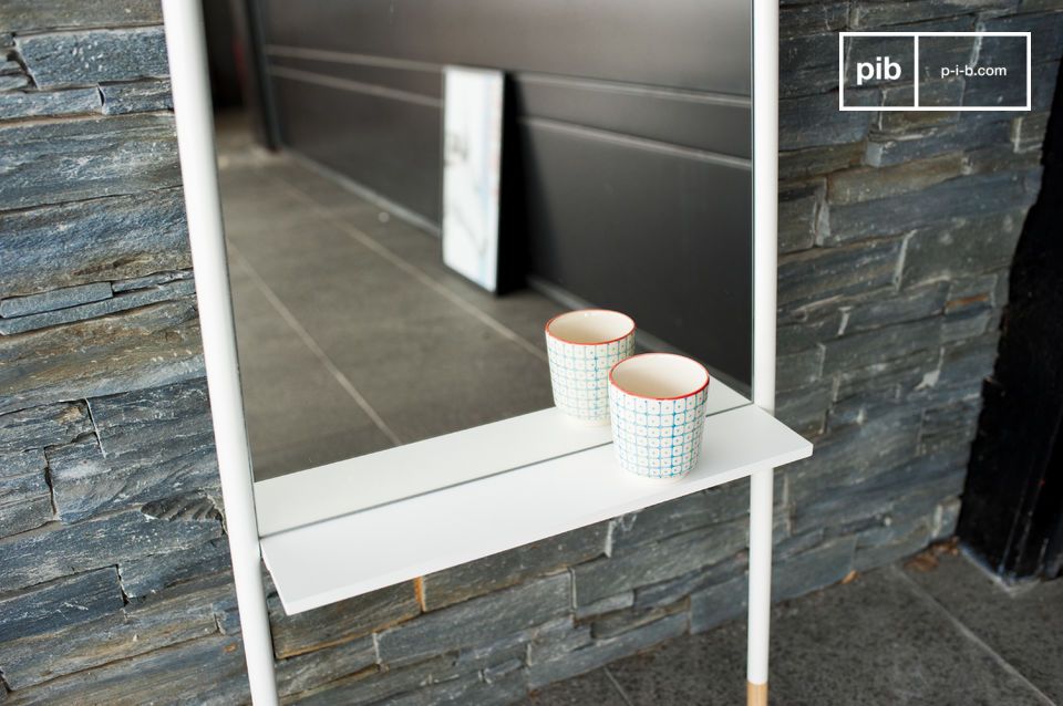 The mirror has a shelf for placing objects.