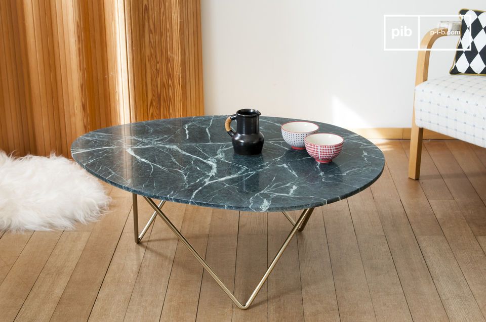 The green marble top rests on a gilded geometric base.