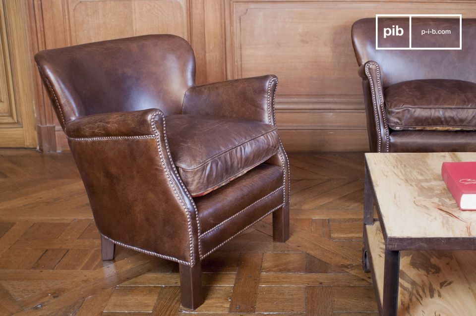 Beautiful leather armchairs in a retro and elegant interior.