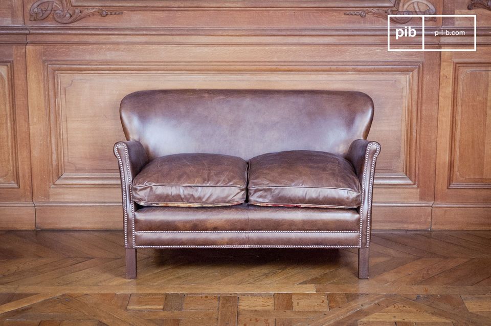 This 2-seater club sofa will dress up the most demanding interiors.