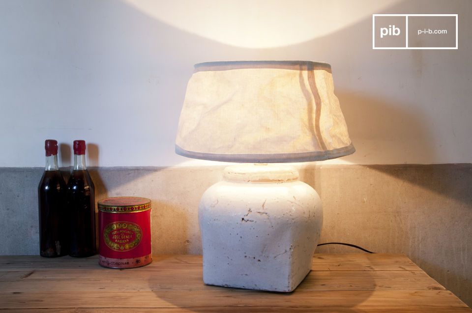 Beautiful terracotta lamp on wooden tray.