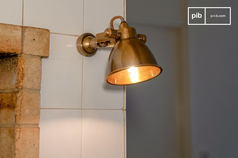 A golden wall lamp in vintage style