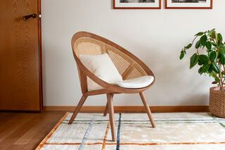 Honey oak-colored solid ash armchair with wicker Cocon