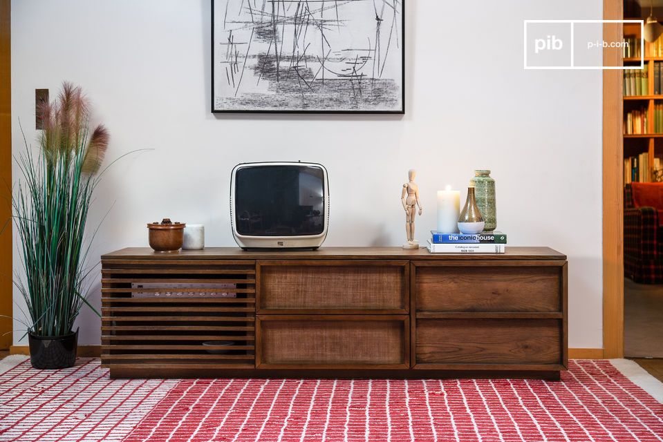 A large TV cabinet with openwork doors.