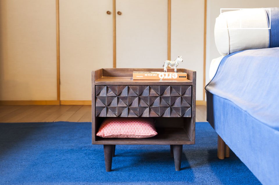 A beautiful bedside table with geometric reliefs.