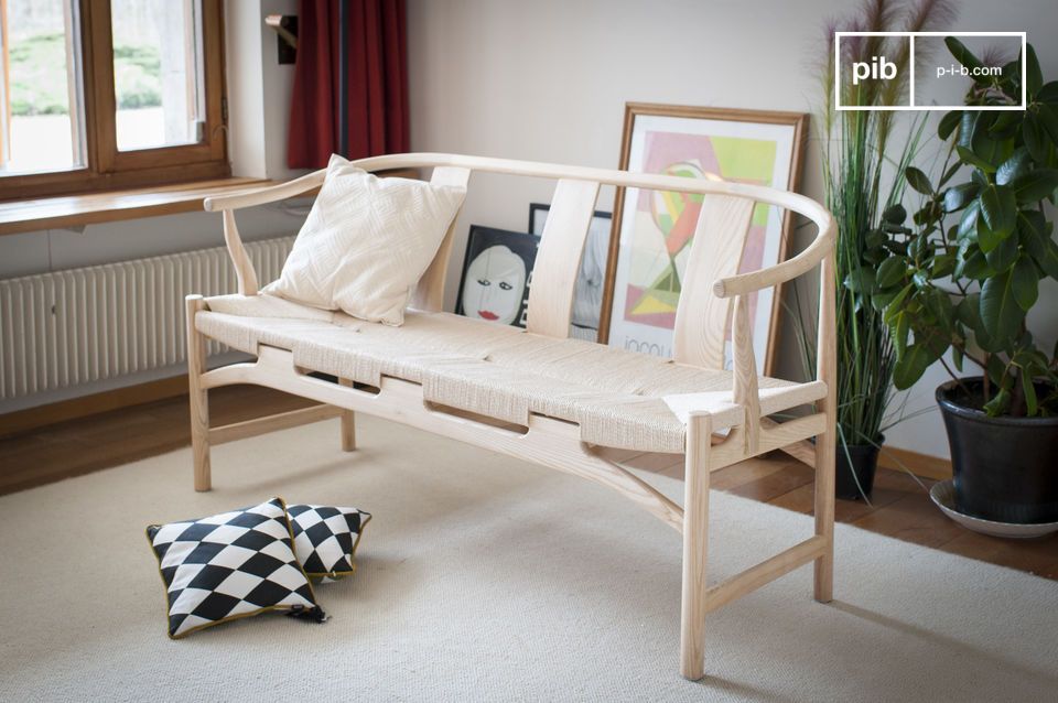 The solid ash wood frame has a natural light-coloured finish.