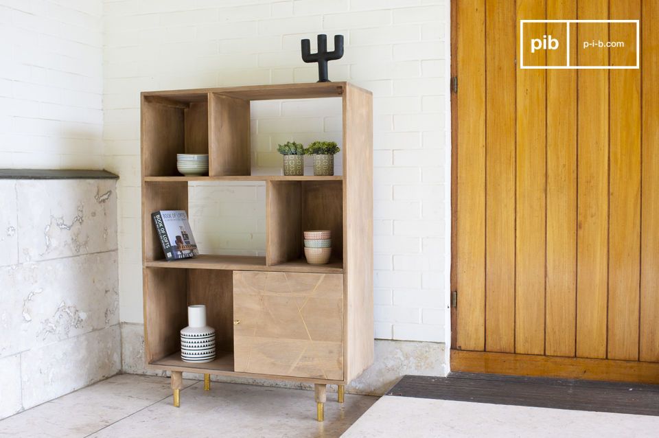 The shelf has pretty golden brass accents.