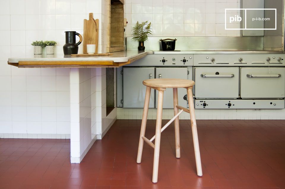 The elegant stool is made entirely of wood.