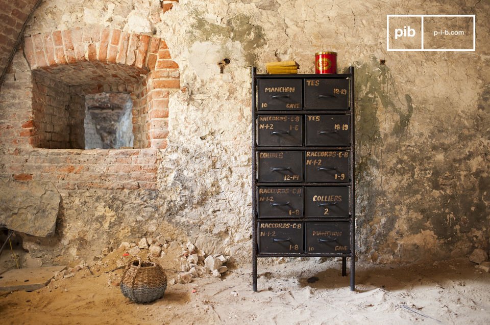 The chest of drawers is made of steel with a beautiful dark grey patina.