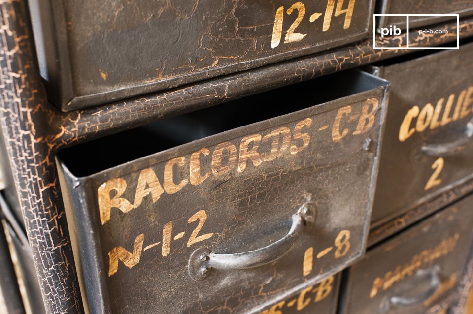 The drawers have pretty gold lettering for a vintage style.